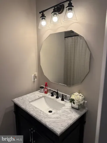 a view of pool with two chairs and a table