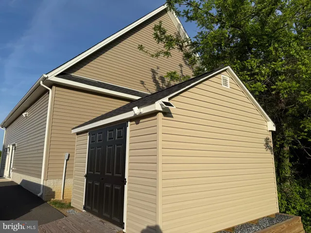 a view of a white house with a large windows