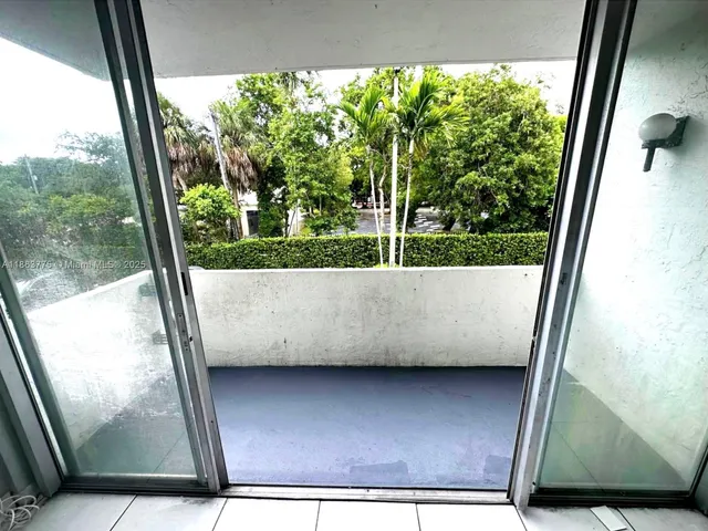 a view of a glass door and the window