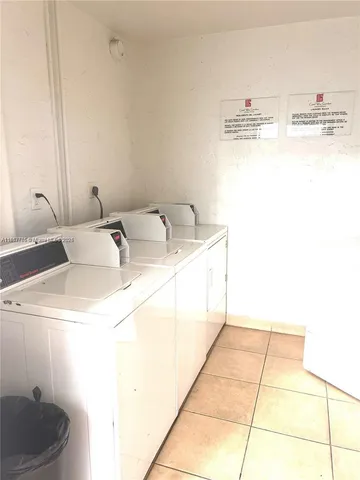 a bathroom with a sink toilet and a mirror