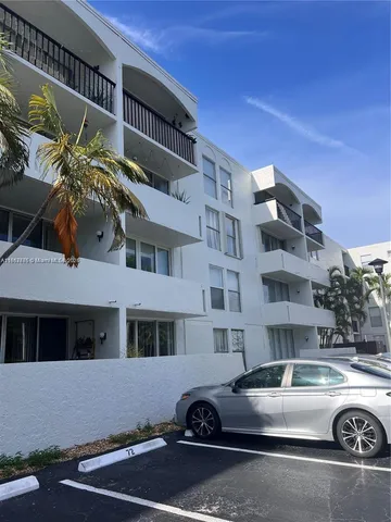 a front view of a house with parking space