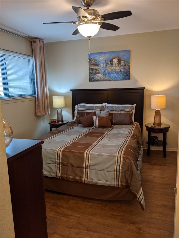 3000 Guadalupe Street, Unit 304 Austin, TX 78705 - Photo 13 of 24 a bedroom with a bed and a chandelier