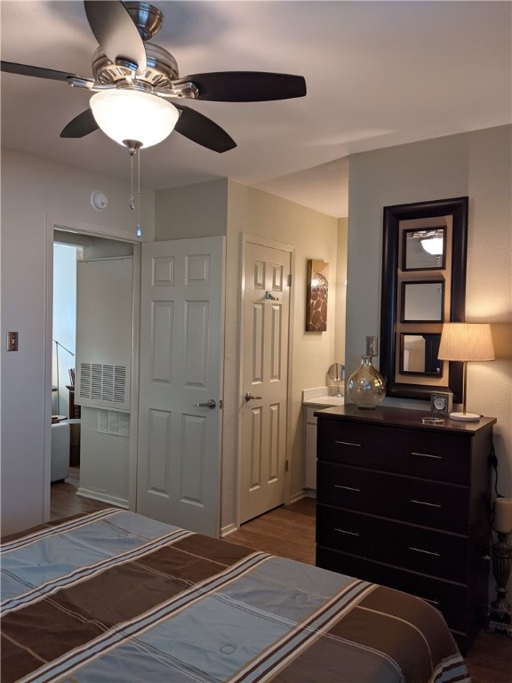 3000 Guadalupe Street, Unit 304 Austin, TX 78705 - Photo 16 of 24 a room with a bed and a chandelier