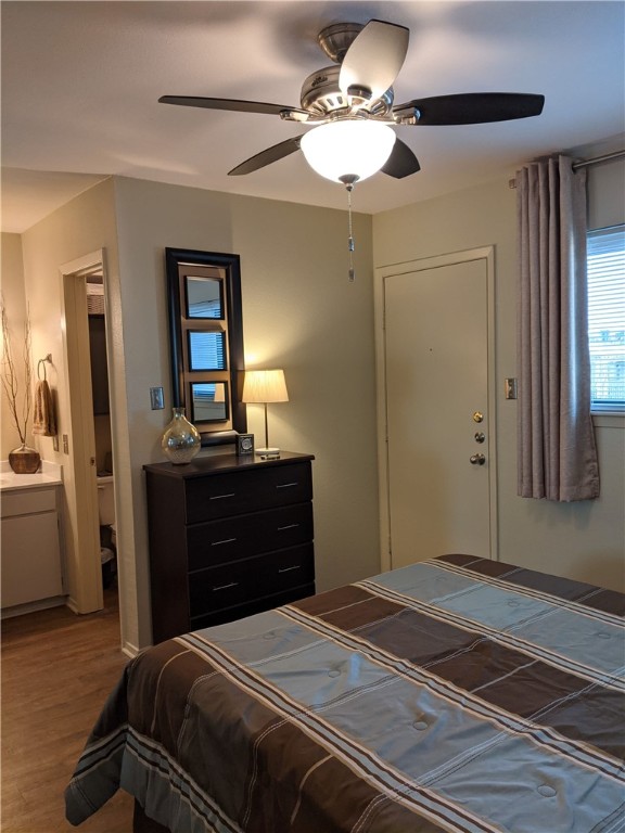 3000 Guadalupe Street, Unit 304 Austin, TX 78705 - Photo 17 of 24 a bedroom with a bed and a chandelier