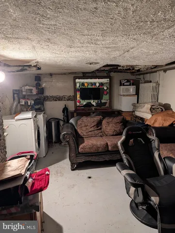 a view of a patio with table and chairs with wooden fence