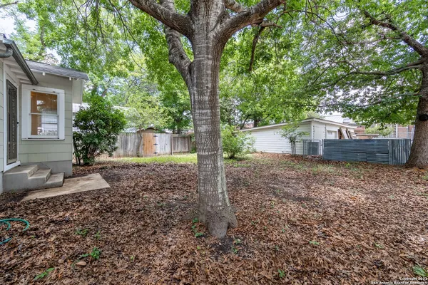 a house view with a backyard space