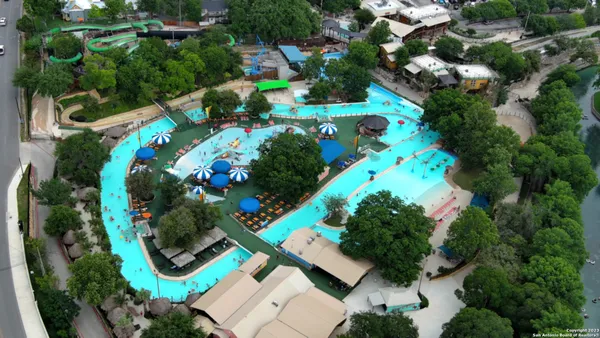 an aerial view of residential house with outdoor space and swimming pool