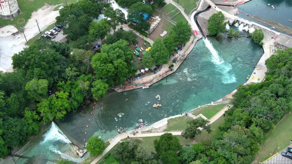 an aerial view of a house with yard