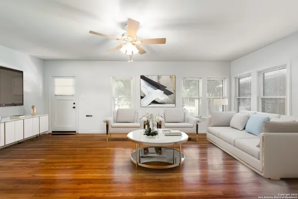 a living room with furniture and a large window