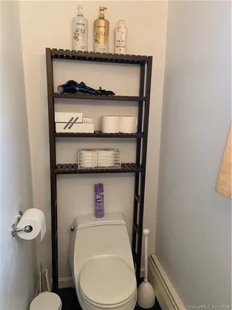 a bathroom with a toilet and a sink
