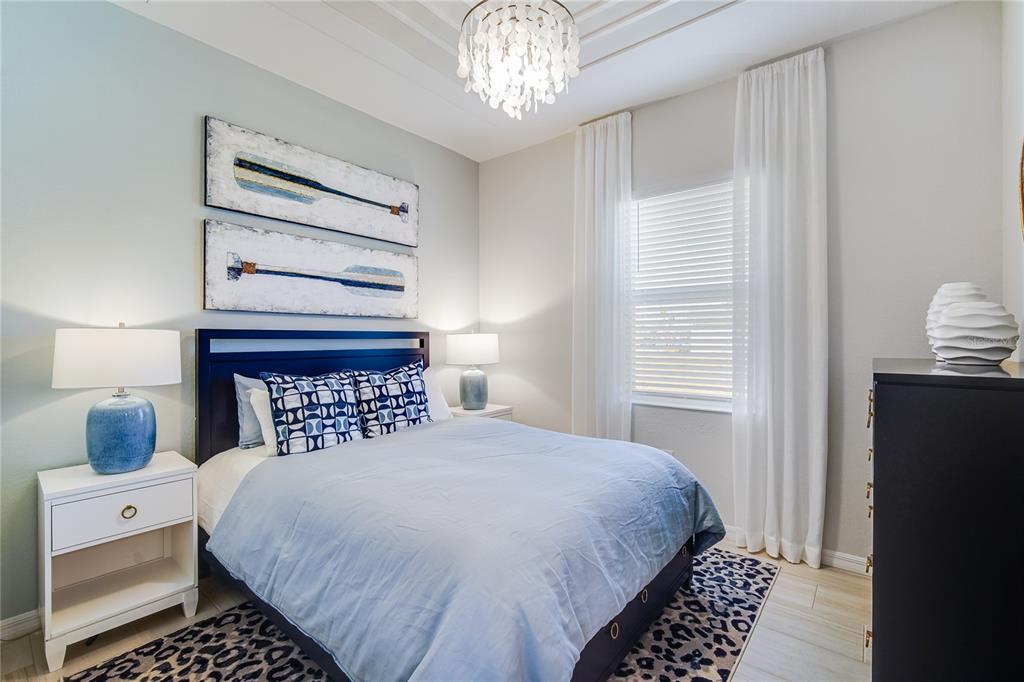 7165 Inlet Isles Lakewood Ranch, FL 34202 - Photo 14 of 26 a bedroom with a bed and a window