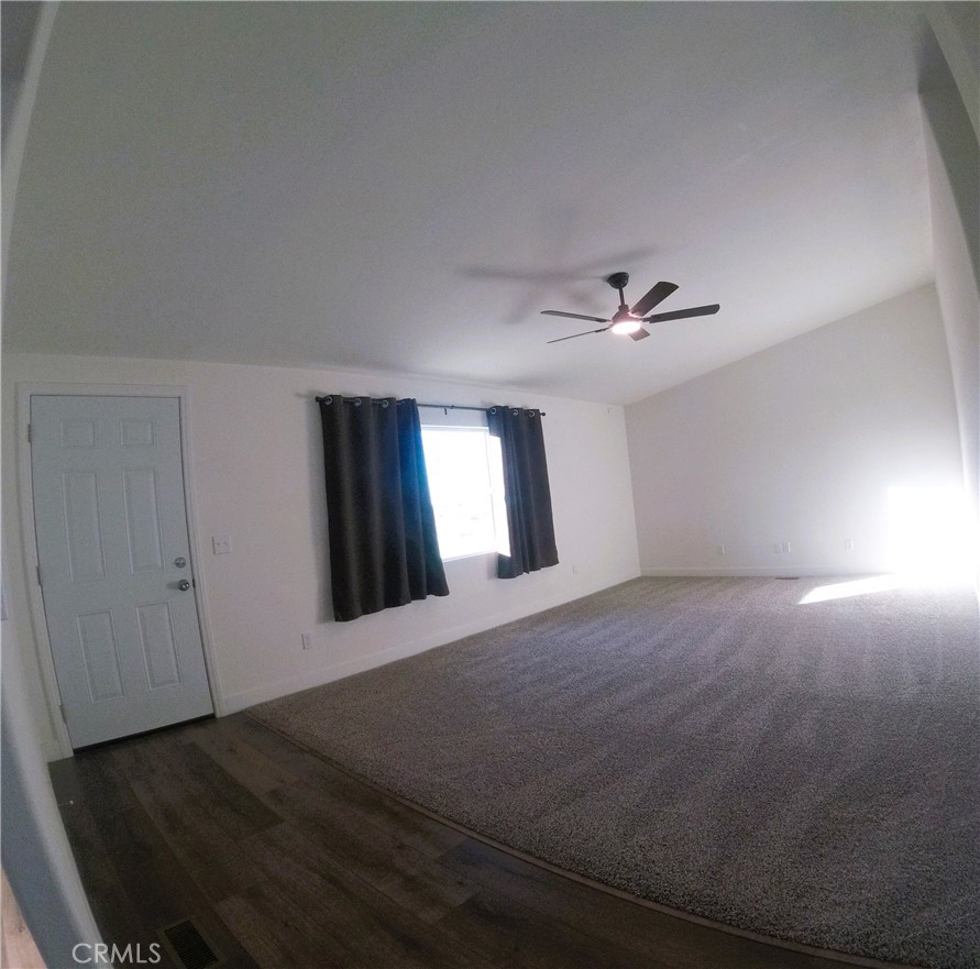 14058 Monte Vista Road Phelan, CA 92371 - Photo 11 of 17 a view of an empty room and window