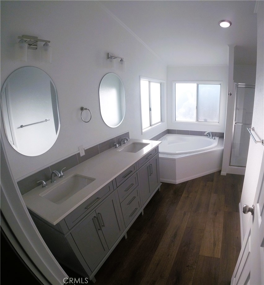 14058 Monte Vista Road Phelan, CA 92371 - Photo 14 of 17 a spacious bathroom with a double vanity sink and a mirror