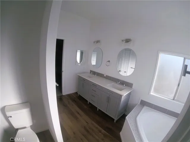 a bathroom with a sink a toilet and a bathtub