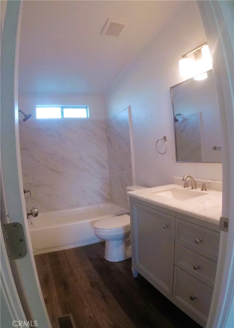 14058 Monte Vista Road Phelan, CA 92371 - Photo 17 of 17 a bathroom with a sink a toilet and a bathtub