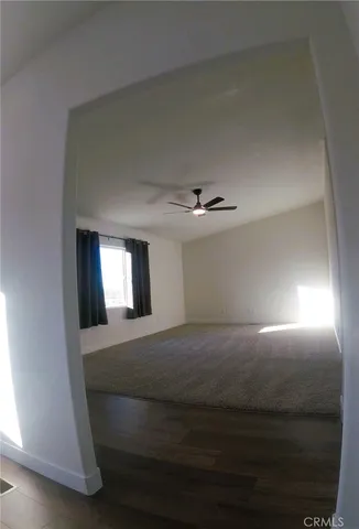 a view of a big room with closet and windows