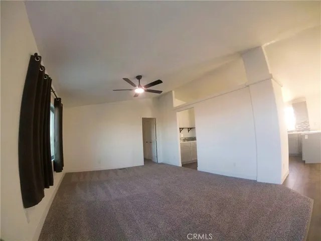 a view of an empty room and window