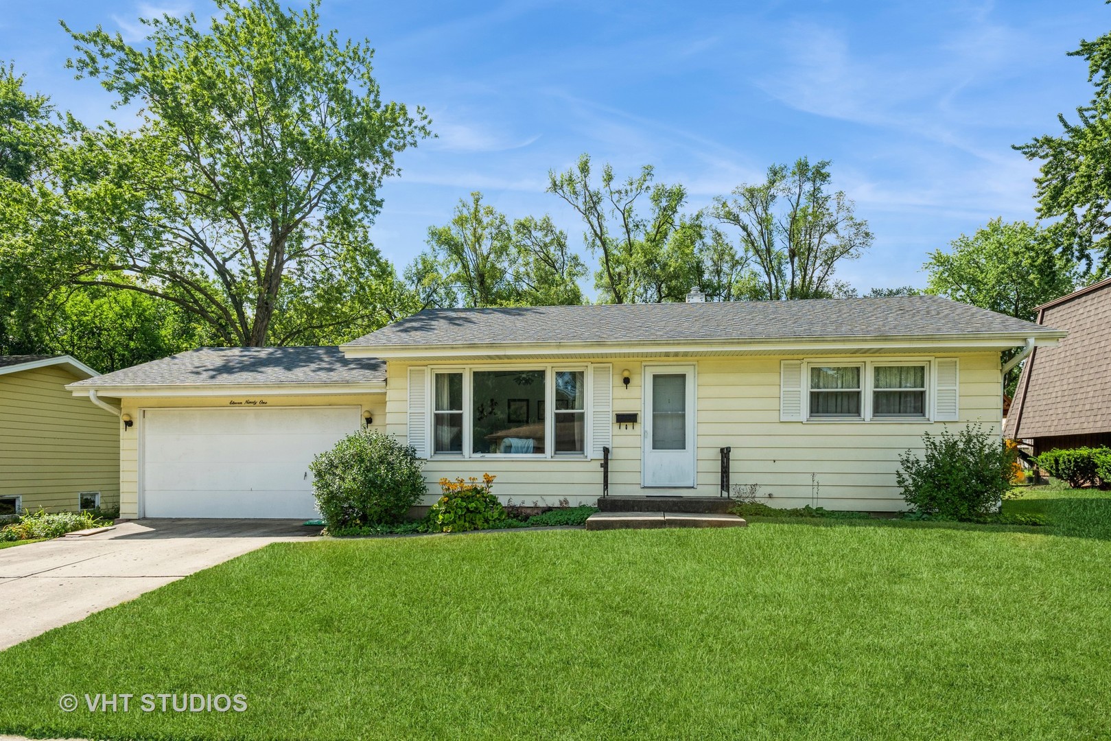 1191 Meadow Lane Elgin, IL 60123 - Photo 3 of 11 front view of a house with a yard