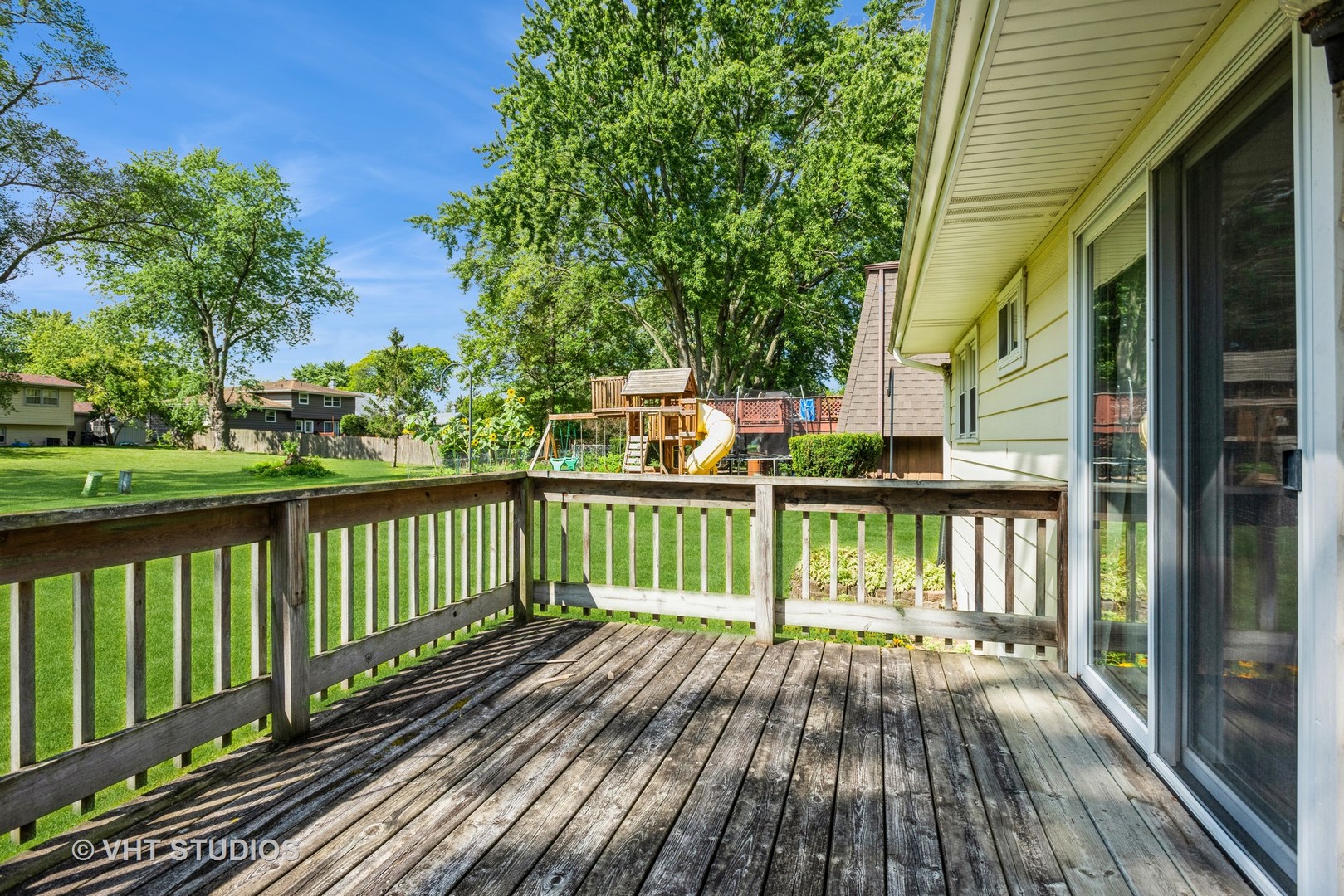 1191 Meadow Lane Elgin, IL 60123 - Photo 4 of 11 a view of balcony with wooden floor and fence