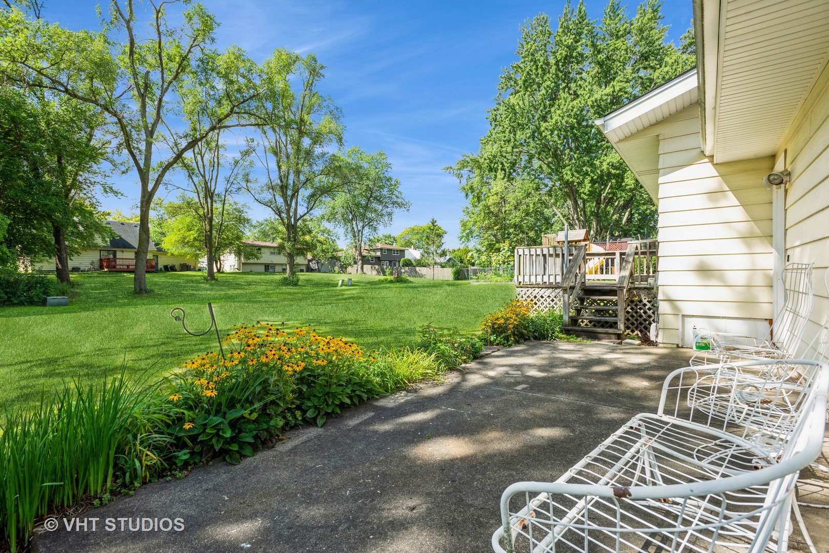 1191 Meadow Lane Elgin, IL 60123 - Photo 5 of 11 a view of a patio with table and chairs and potted plants
