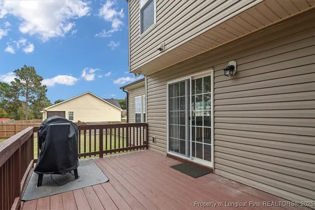 a front view of a house with a deck
