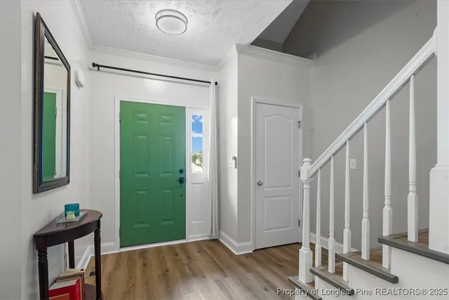 a view of entryway with wooden floor