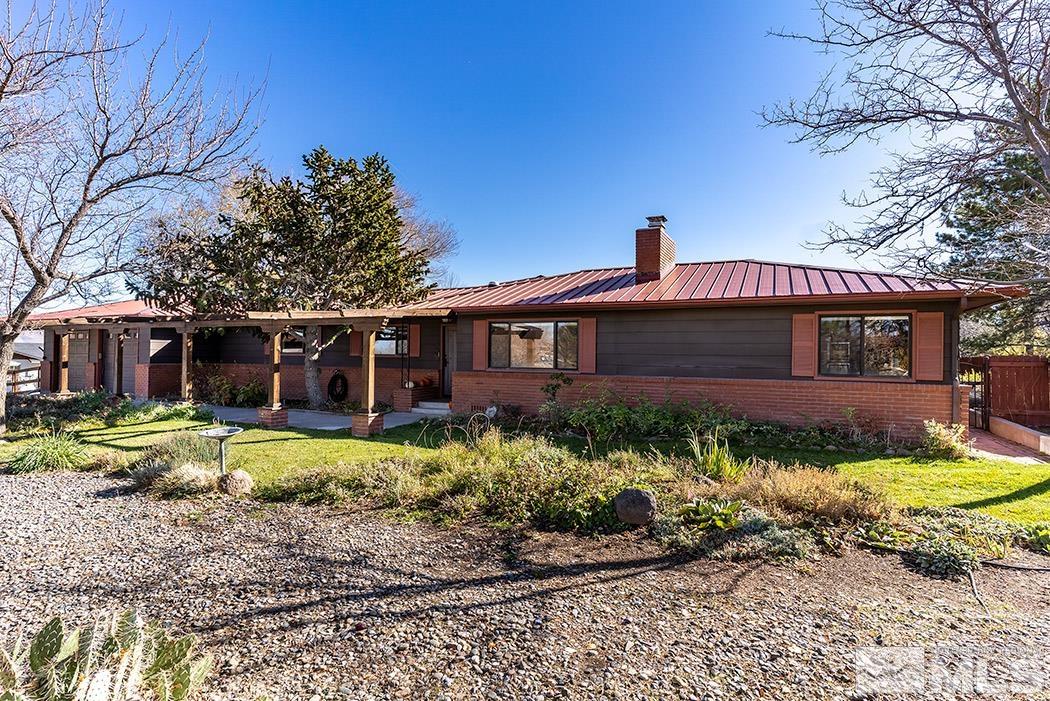 1010 Foothill Road Reno, NV 89511 - Photo 2 of 40 a front view of a house with a yard