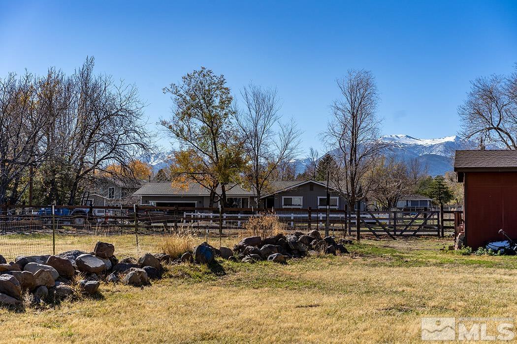 1010 Foothill Road Reno, NV 89511 - Photo 29 of 40 a view of swimming pool with outdoor seating and trees in the background