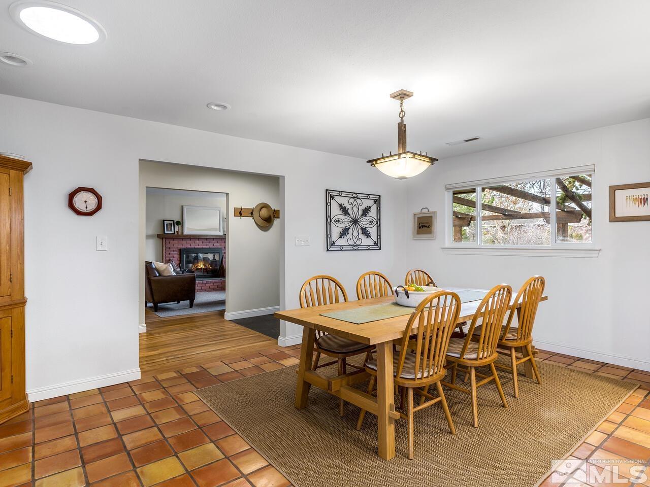1010 Foothill Road Reno, NV 89511 - Photo 9 of 40 a dining room with furniture and a chandelier