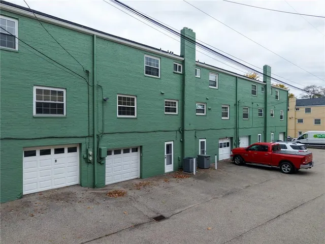 an aerial view of a house with a garden