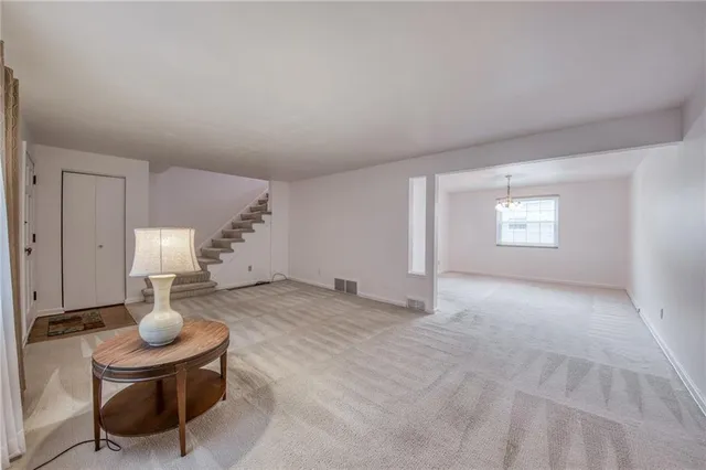 a view of a livingroom with furniture and window