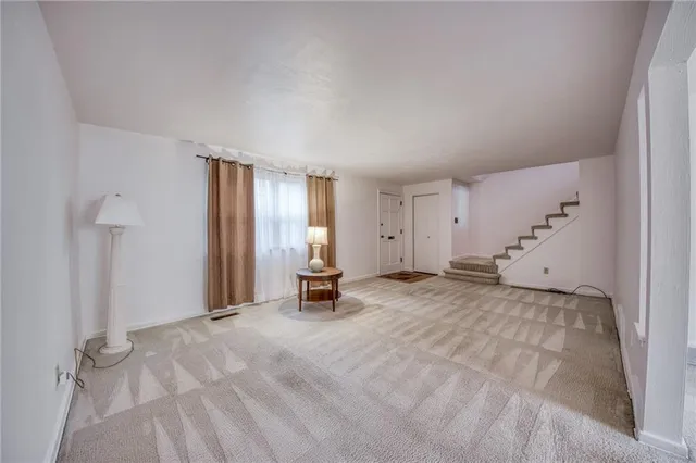 a view of a livingroom with a staircase