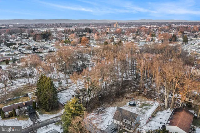an aerial view of residential building with parking space