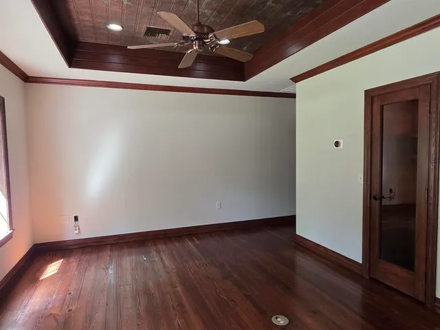 a view of entryway with wooden floor and livingroom