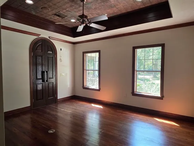 a beautiful room with kitchen appliances and chandelier
