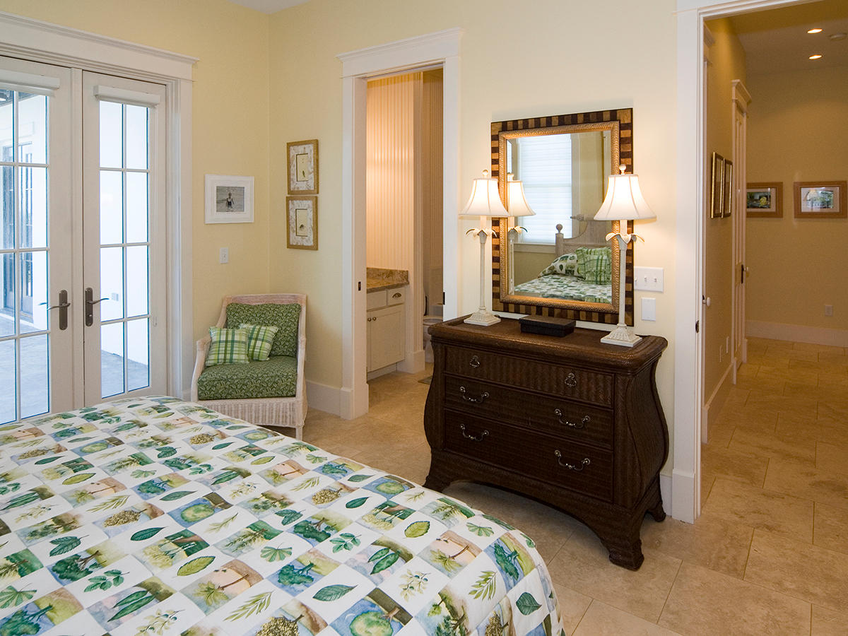 288 Blue Mountain Beach Road Santa Rosa Beach, FL 32459 - Photo 18 of 28 a bedroom with a bed and a dresser