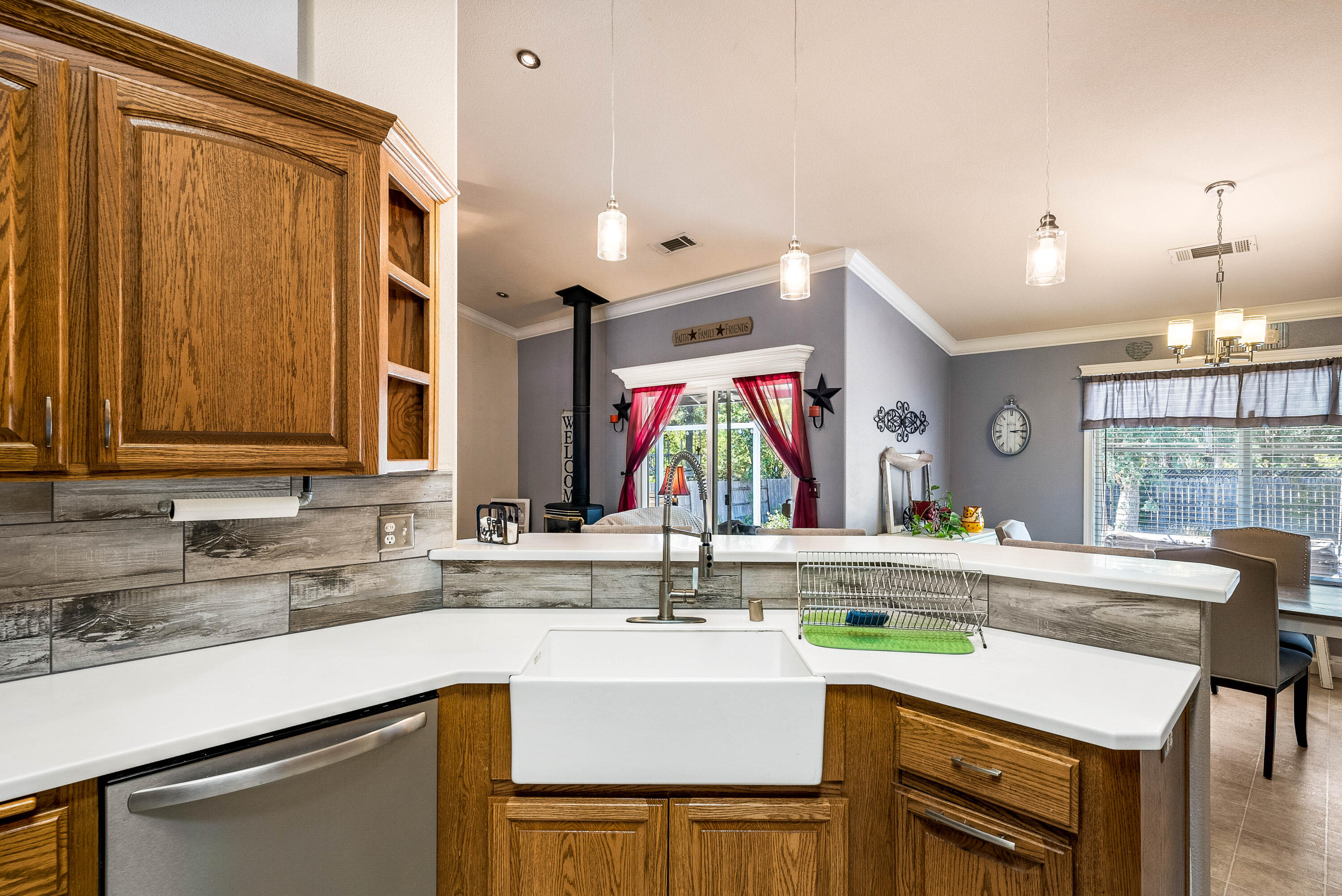 3255 Lawrence Road Redding, CA 96002 - Photo 11 of 27 a kitchen with a sink and a refrigerator