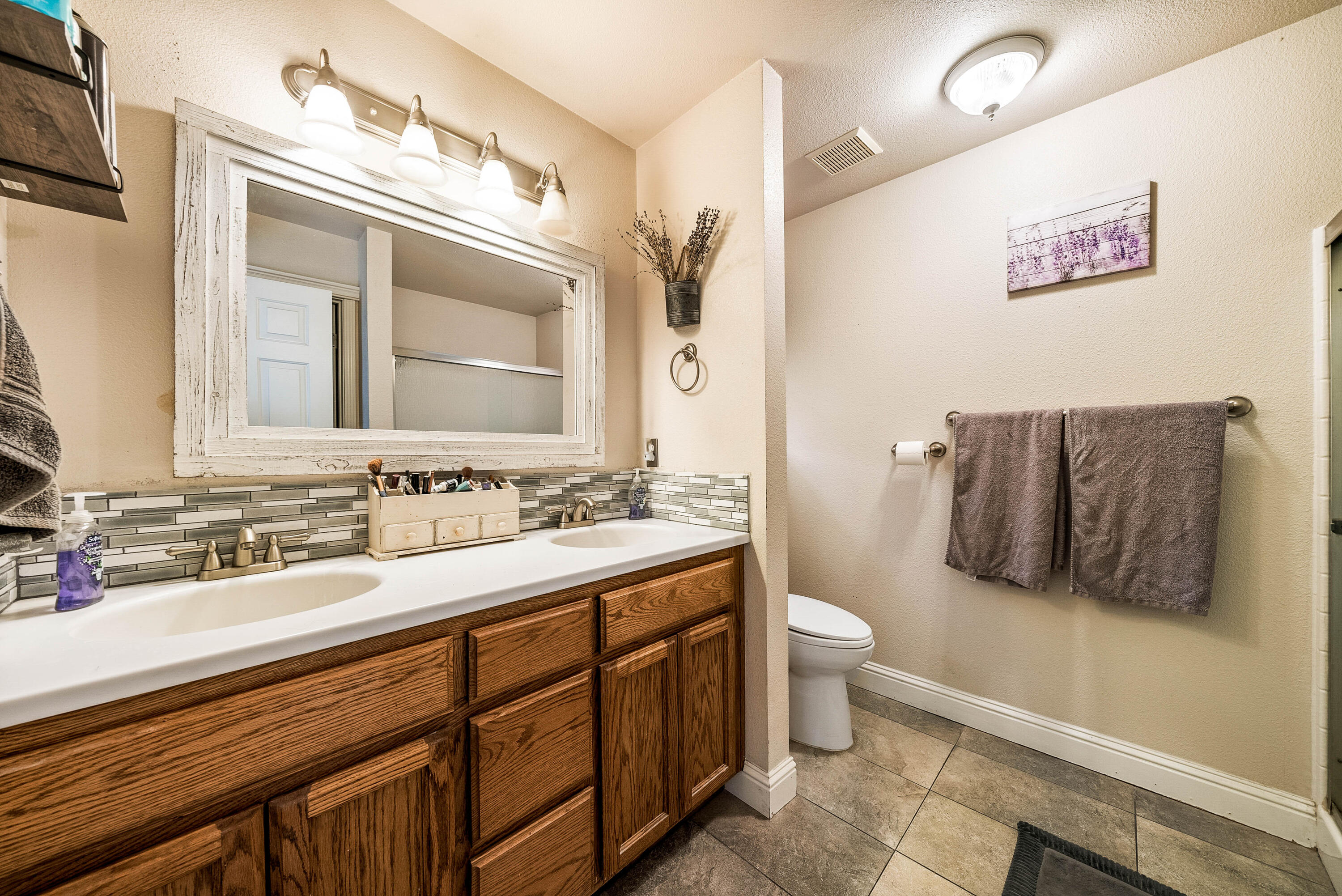 3255 Lawrence Road Redding, CA 96002 - Photo 17 of 27 a bathroom with a toilet sink and mirror