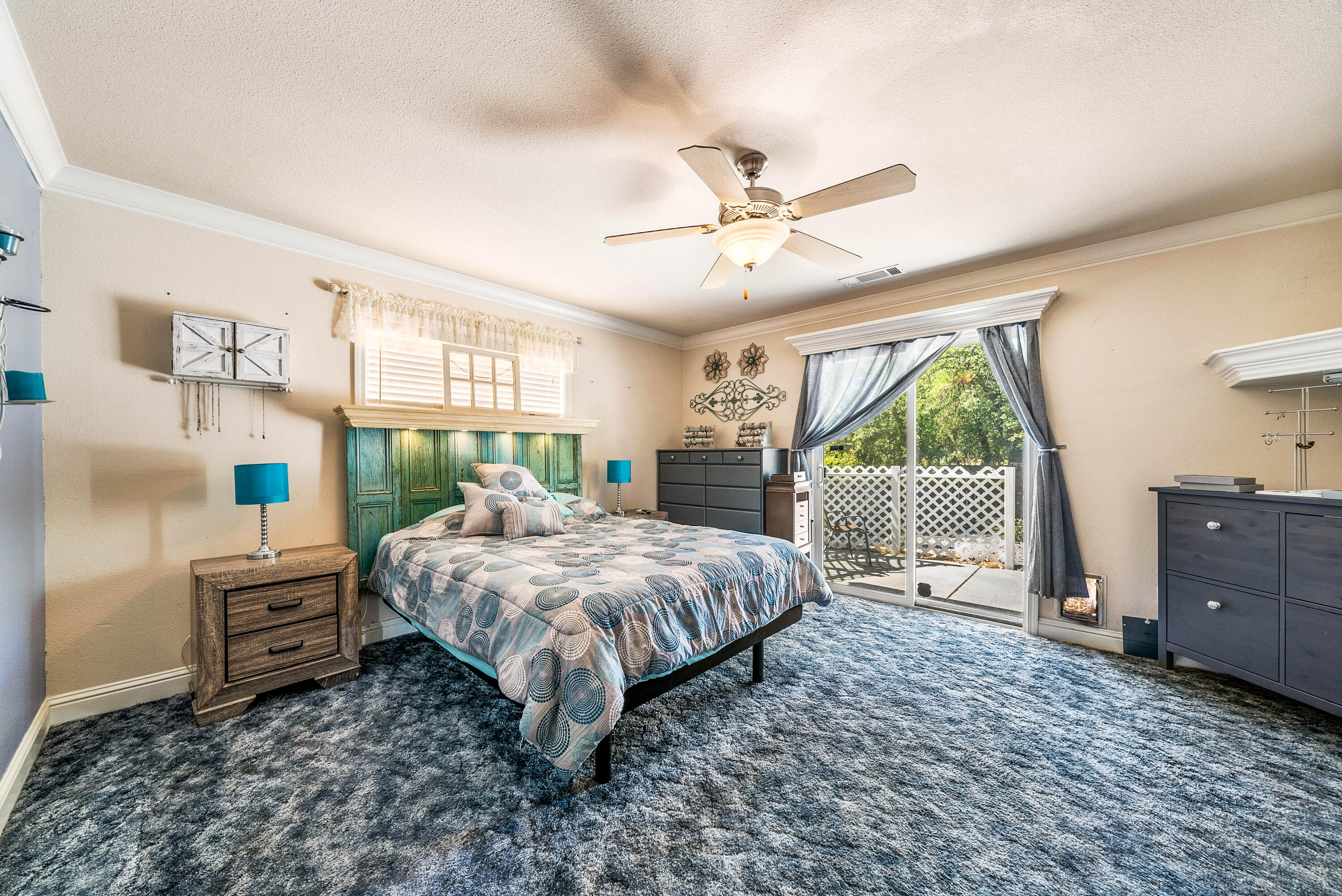 3255 Lawrence Road Redding, CA 96002 - Photo 19 of 27 a bed room with a bed and a window