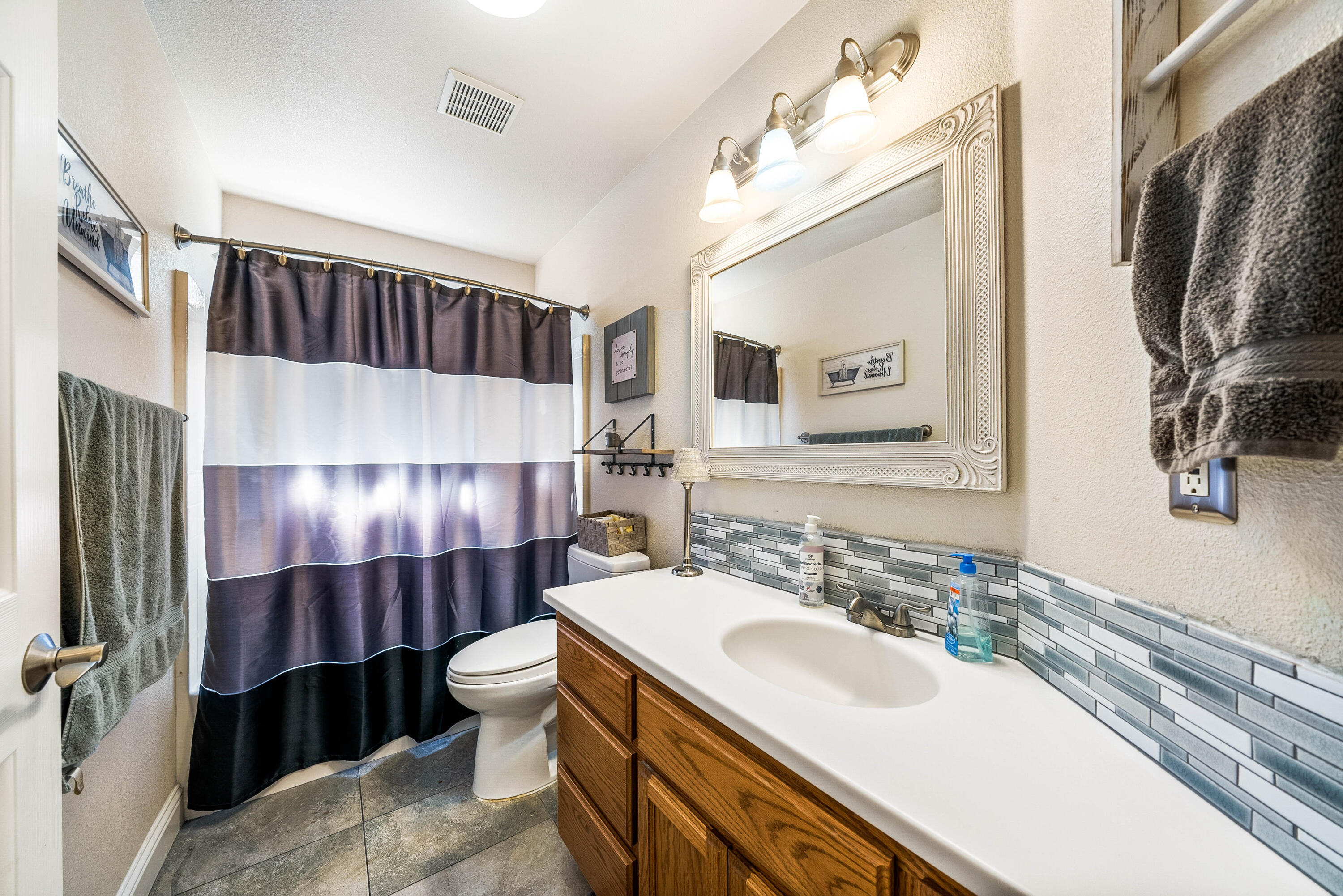 3255 Lawrence Road Redding, CA 96002 - Photo 20 of 27 a bathroom with a sink and a mirror