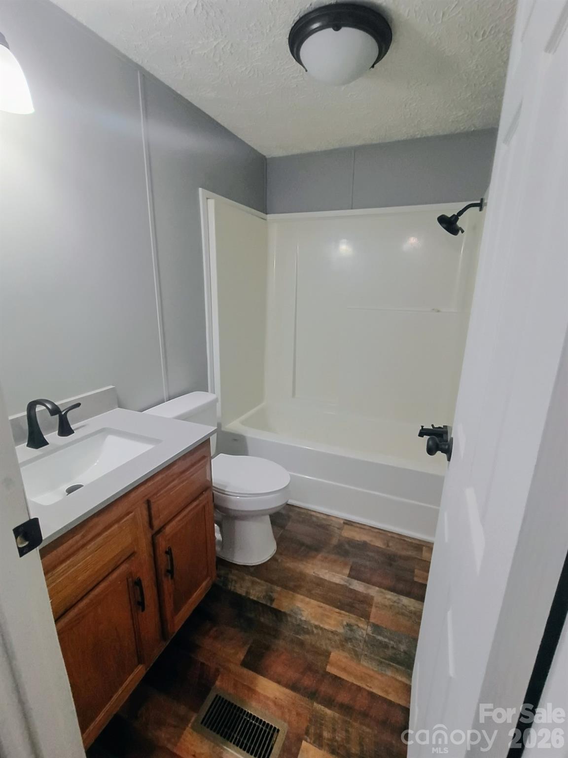 308 Chimney Rock Road Rutherfordton, NC 28139 - Photo 13 of 23 a bathroom with a granite countertop sink toilet and shower