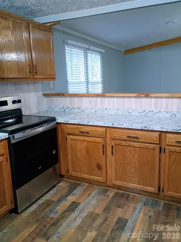 a view of balcony with wooden floor and fence