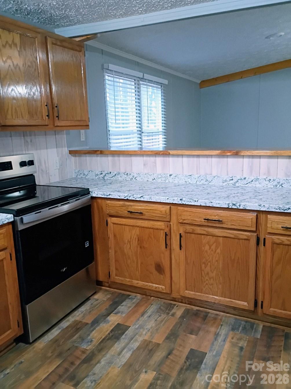 308 Chimney Rock Road Rutherfordton, NC 28139 - Photo 18 of 23 a kitchen with granite countertop a sink and cabinets