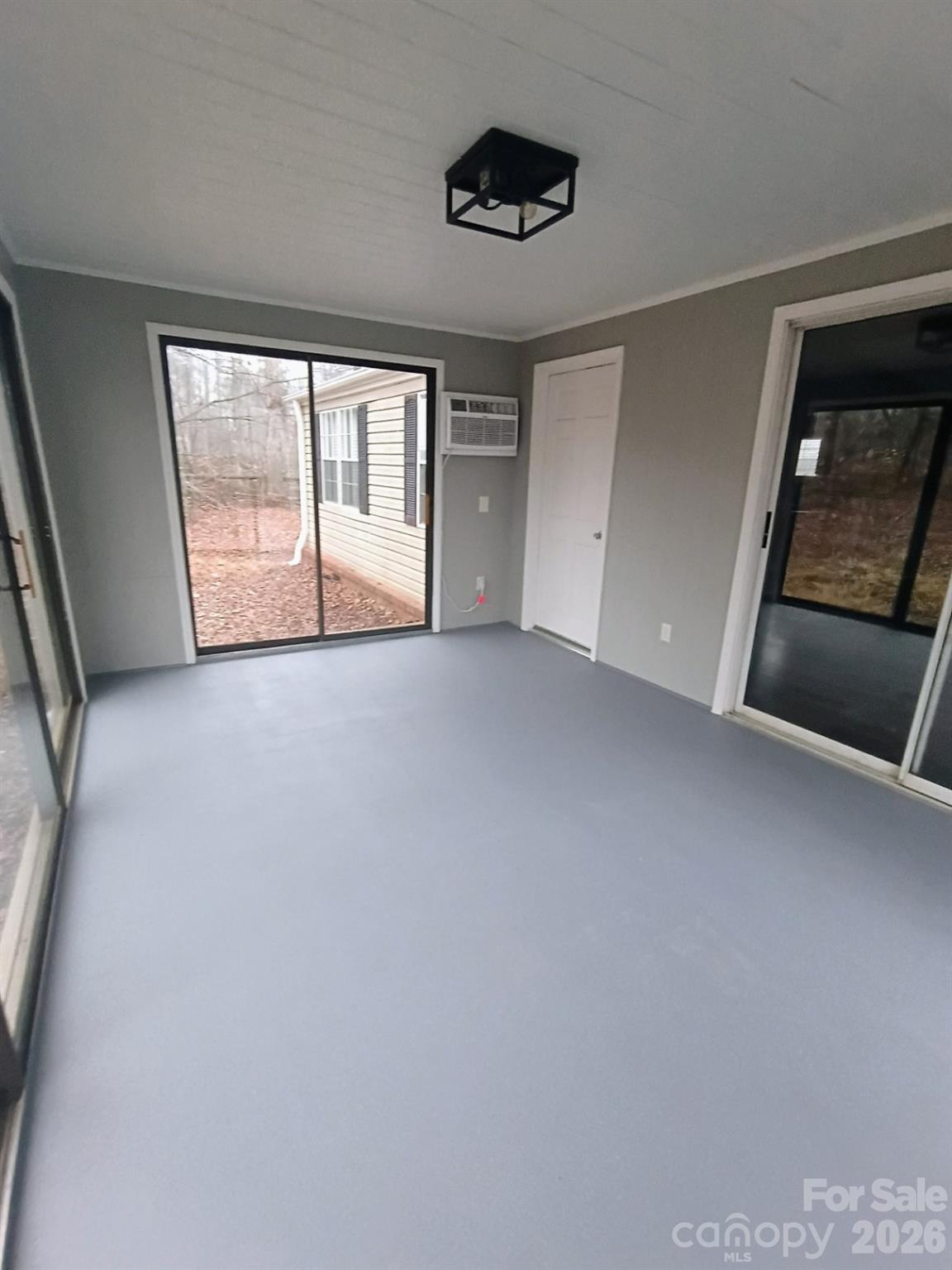 308 Chimney Rock Road Rutherfordton, NC 28139 - Photo 4 of 23 a view of an empty room with a window and a kitchen