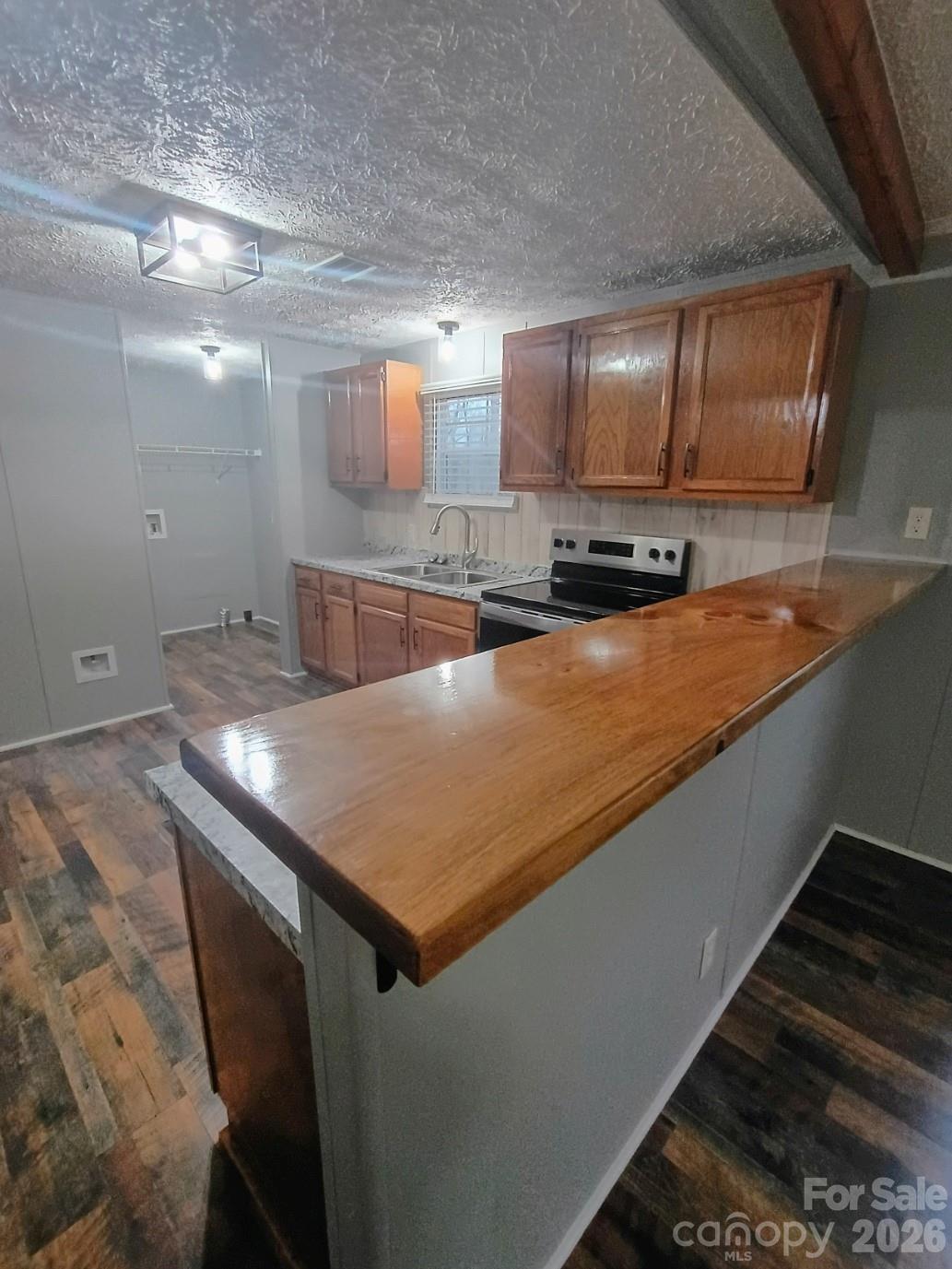 308 Chimney Rock Road Rutherfordton, NC 28139 - Photo 10 of 23 a kitchen with stainless steel appliances granite countertop a sink a stove counter space and cabinets