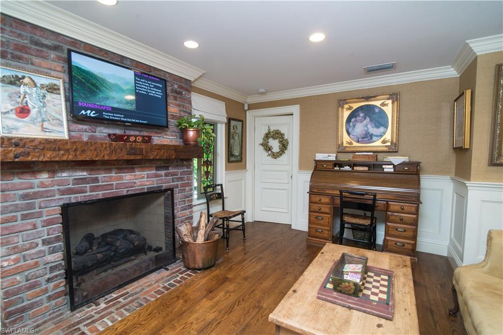 732 Bay Tree Court Naples, FL 34108 - Photo 6 of 21 Gathering Room with Fireplace