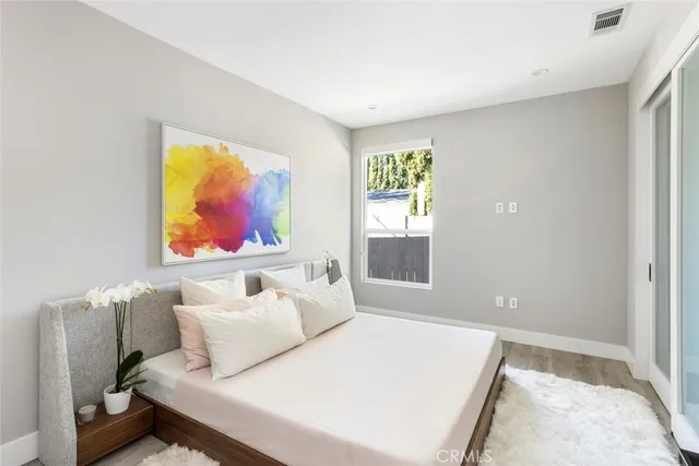 a bedroom with a bed and furniture