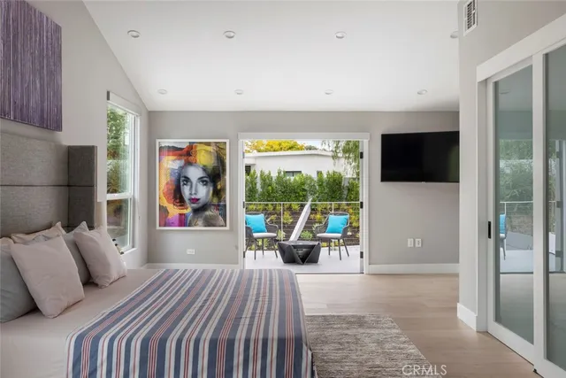 a view of a patio with couches chairs and a table and potted plants