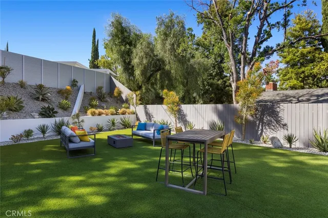 a view of swimming pool with outdoor seating