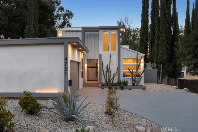 a balcony with table and chairs